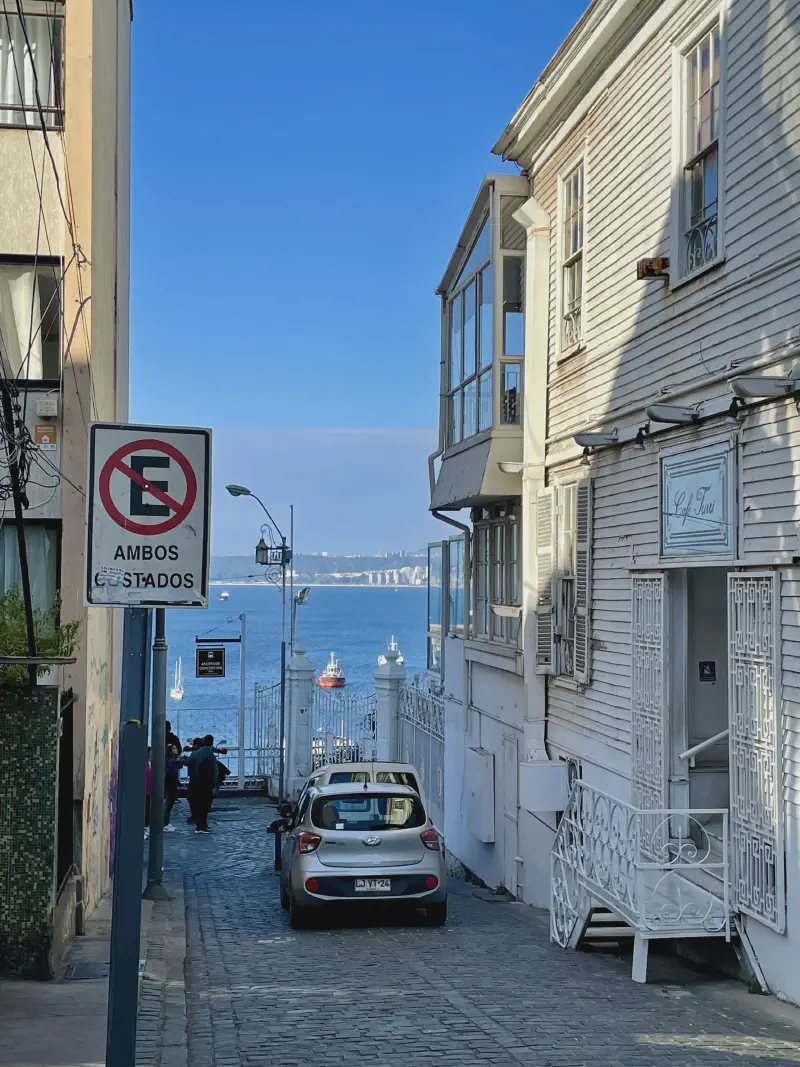 
A view for the sea from a street.
